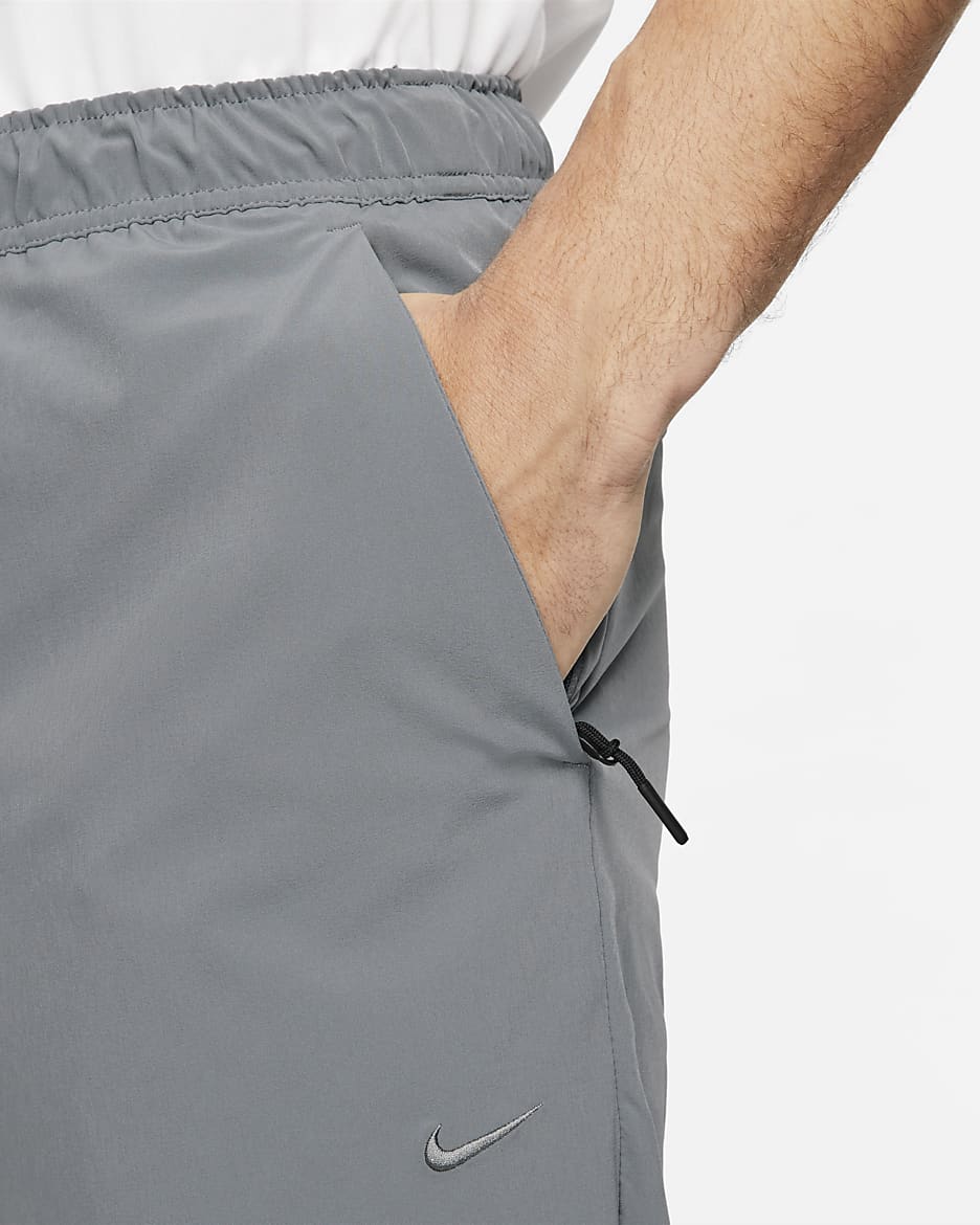 Nike men's pants with zipper pockets best sale